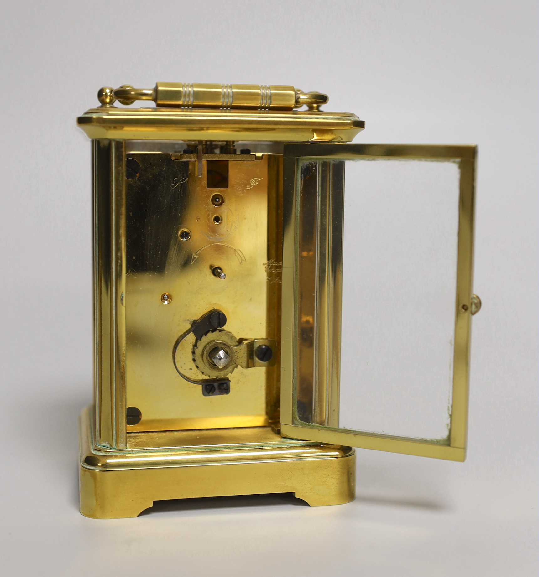 A brass eight day carriage timepiece, retailed by Comitti of London, 12cm high